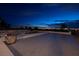 Inviting pool area with a spacious deck and breathtaking city views at night at 979 Evening Dew Dr, Las Vegas, NV 89110