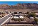 Beautiful backyard with pool, lush greenery, and mountain views at 979 Evening Dew Dr, Las Vegas, NV 89110