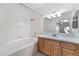 Bright bathroom featuring a tub, a shower, and a vanity with new light fixtures at 10100 Jacob Pl # 204, Las Vegas, NV 89144