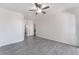 Spacious bedroom features a ceiling fan and light gray wood-look flooring at 10100 Jacob Pl # 204, Las Vegas, NV 89144
