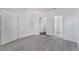 Bedroom featuring light gray wood-look flooring, with ensuite bathroom at 10100 Jacob Pl # 204, Las Vegas, NV 89144