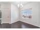 Dining area featuring modern lighting fixture, window views, hardwood flooring, and neutral paint at 10100 Jacob Pl # 204, Las Vegas, NV 89144
