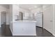 Clean kitchen showcasing a breakfast bar, stainless steel sink, and white appliances at 10100 Jacob Pl # 204, Las Vegas, NV 89144