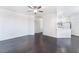 Open-concept living space featuring hardwood floors, neutral walls, and ceiling fan at 10100 Jacob Pl # 204, Las Vegas, NV 89144