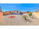 Spacious backyard featuring rock landscaping and trees, offering ample space for outdoor activities at 1012 Terron Allen Ave, North Las Vegas, NV 89031