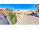 Large backyard with desert landscaping, artificial turf, and mature plantings at 1012 Terron Allen Ave, North Las Vegas, NV 89031