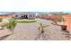 Expansive backyard with desert landscaping and a patch of artificial turf at 1012 Terron Allen Ave, North Las Vegas, NV 89031
