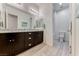 Modern bathroom features a double sink with granite countertops and an open shower at 1012 Terron Allen Ave, North Las Vegas, NV 89031