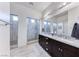 Modern bathroom features a double vanity, granite countertop, and walk-in shower at 1012 Terron Allen Ave, North Las Vegas, NV 89031
