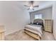 Bedroom features carpeted floors, ceiling fan, and natural light at 1012 Terron Allen Ave, North Las Vegas, NV 89031