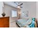 Cozy bedroom featuring a ceiling fan and natural light from the window at 1012 Terron Allen Ave, North Las Vegas, NV 89031