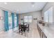 Dining area features natural light, sliding glass doors, and views of the backyard at 1012 Terron Allen Ave, North Las Vegas, NV 89031