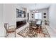 Dining room with modern chandelier, wood table set, elegant décor, and a seamless transition to the kitchen at 1012 Terron Allen Ave, North Las Vegas, NV 89031