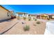 Charming home featuring desert landscaping, a two-car garage, and a neutral color scheme under a bright blue sky at 1012 Terron Allen Ave, North Las Vegas, NV 89031