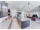 Open kitchen featuring a large island with granite countertops, stainless appliances, and pendant lighting at 1012 Terron Allen Ave, North Las Vegas, NV 89031