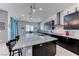 Bright, open kitchen features a large island, granite countertops, and stainless steel appliances at 1012 Terron Allen Ave, North Las Vegas, NV 89031