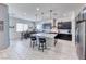 Spacious kitchen features a large island, granite countertops, stainless steel appliances, and dining area at 1012 Terron Allen Ave, North Las Vegas, NV 89031