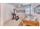 Bright office space with neutral walls, carpet, and home gym equipment at 1012 Terron Allen Ave, North Las Vegas, NV 89031