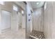 Walk-in shower features upscale shower head and tile design at 1012 Terron Allen Ave, North Las Vegas, NV 89031
