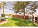 Lush backyard features a playground, garden bed and plenty of lawn space for outdoor activities at 1088 Casady Hollow Ave, Henderson, NV 89012