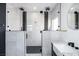 Sleek bathroom boasts a glass-enclosed shower with dual shower heads and modern vanity at 1088 Casady Hollow Ave, Henderson, NV 89012