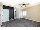 Spacious bedroom features soft carpet flooring, ceiling fan, and large window for natural light at 1088 Casady Hollow Ave, Henderson, NV 89012