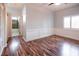 Bright bedroom with wood floors and wainscoting, with ensuite bathroom access at 1088 Casady Hollow Ave, Henderson, NV 89012