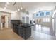 Spacious kitchen featuring granite counters, a kitchen island, and abundant lighting at 1088 Casady Hollow Ave, Henderson, NV 89012