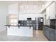 Open concept kitchen with granite countertops, stainless steel appliances, and breakfast bar at 1088 Casady Hollow Ave, Henderson, NV 89012