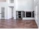 Bright living room featuring a fireplace, hardwood floors, and backyard access at 1088 Casady Hollow Ave, Henderson, NV 89012