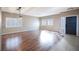 Bright living room with sleek wood flooring, modern lighting, and plantation shutters at 1088 Casady Hollow Ave, Henderson, NV 89012