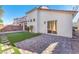 View of the back of the house from the backyard with sliding glass door at 10955 Sospel Pl, Las Vegas, NV 89141