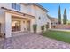 Spacious backyard with covered patio and low maintenance artificial turf at 10955 Sospel Pl, Las Vegas, NV 89141