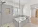 Bathroom featuring separate shower and tub with bright window at 10955 Sospel Pl, Las Vegas, NV 89141