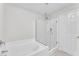 Modern bathroom featuring a glass-enclosed shower and a soaking tub at 10955 Sospel Pl, Las Vegas, NV 89141