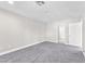 Bedroom with neutral carpeting and a door to hall at 10955 Sospel Pl, Las Vegas, NV 89141