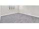 Bedroom with neutral carpeting and plantation shutters allowing natural light to enter at 10955 Sospel Pl, Las Vegas, NV 89141