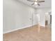 Spacious bedroom with hardwood floors and open door to ensuite bathroom at 10955 Sospel Pl, Las Vegas, NV 89141