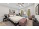 Relaxing bedroom features a walkout patio, neutral tones, and a comfortable bed for a serene retreat at 10955 Sospel Pl, Las Vegas, NV 89141