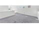Cozy bonus room with soft carpeting and abundant natural light, ideal for relaxation or activities at 10955 Sospel Pl, Las Vegas, NV 89141