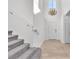Bright entryway with hardwood floors, chandelier and gray carpet stairs at 10955 Sospel Pl, Las Vegas, NV 89141