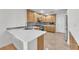 Functional kitchen with white countertops, stainless steel appliances, and wood cabinetry at 10955 Sospel Pl, Las Vegas, NV 89141