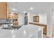 Bright kitchen with white countertops, stainless steel appliances, and warm wood cabinetry at 10955 Sospel Pl, Las Vegas, NV 89141