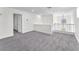 Spacious loft featuring neutral carpeting and view of arched window at 10955 Sospel Pl, Las Vegas, NV 89141