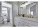 Bathroom featuring dual sinks and modern lighting at 1645 Indian Cove Ln, Las Vegas, NV 89128