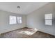 Neutral bedroom features natural light and plush carpeting at 1645 Indian Cove Ln, Las Vegas, NV 89128