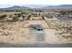 An aerial view showcases a home with an attached two-car garage and large, fenced-in yard at 1660 W Princeton Cir, Pahrump, NV 89060