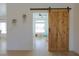 Bonus room or flex space with natural light and sliding barn door at 1660 W Princeton Cir, Pahrump, NV 89060