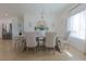 Elegant dining room with a chandelier and large window at 1660 W Princeton Cir, Pahrump, NV 89060