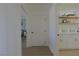 Hallway with door leading to laundry room, and ensuite bedroom at 1660 W Princeton Cir, Pahrump, NV 89060